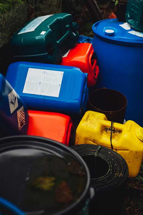 Empty gas cans and barrels, Horizon Environmental Hazardous Material Services